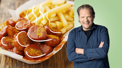 Das Bild zeigt Björn Freitag und einen Currywurst Teller