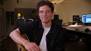 Tim Kamrad und Gitarre