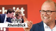 Hendrik Wüst (CDU) und Mona Neubauer (Grüne) tuscheln im Vordergrund, während Jochen Ott (SPD) auf sie zeigt