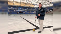 Olaf Kuchenbecker mit seinem Messrad am Bildrand