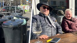 Uschi und Martin Seul sitzen mit einem Glas Wein vor einem Lokal.