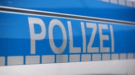 Die Tür eines Polizeiautos (Symbolfoto)