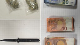 Das Bild zeigt beschlagnahmtes Falschgeld, Marihuana und ein Messer.