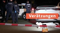 Mehrere Polizisten stehen an einem Tatort