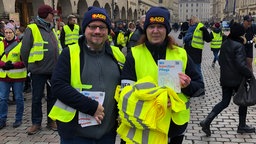 Zwei Demonstranten auf der Pflege-Demo in Münster. 