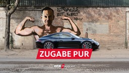 Satirische Fotomontage: Ein Porsche steht vor einer Steinwand, auf der Volker Wissing im Stile eines Banksy-Graffitis abgebildet ist