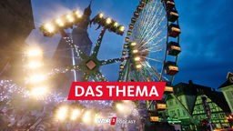 Zwei Fahrgeschäfte drehen sich auf der Allerheiligenkirmes in Soest