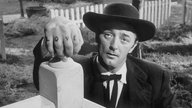 Der US-amerikanische Schauspieler Robert Mitchum im Film "Die Nacht des Jägers", aus dem Jahr 1955.