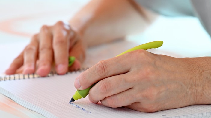 Hand mit Stift