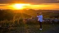 Reporterin Claudia Kracht fotografiert den Sonnenuntergang