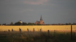 Der Blick auf St. Hubert bei Sonnenuntergang.