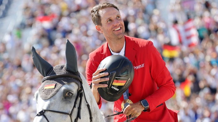 Christian Kukuk jubelt bei den Olympischen Spielen über Gold auf Checker 47