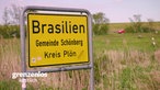 Das Bild zeigt das Ortsschild zu Brasilien in Schönberg bei Kiel.