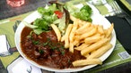 Das Bild zeigt das Gericht „Carbonade flamande“, Rindfleisch in Biersoße geschmort.